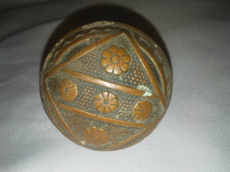 lot 208 image: Antique ornate copper doorknob.