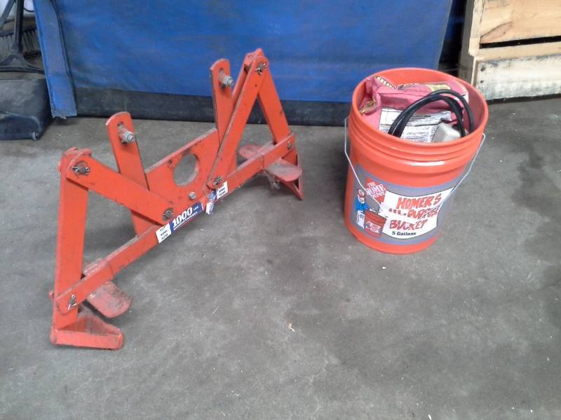 lot 859 image: Wesco Industrial 1000 lbs. Capacity Drum Jack, Bucket Of Concrete Mix