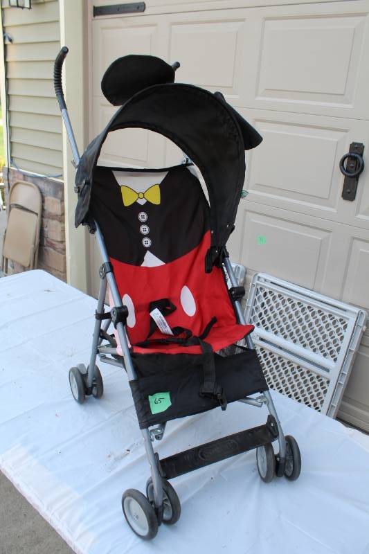 lot 65 image: Cosco Childrens Stroller with Canopy and Storage