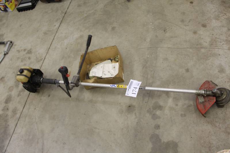 lot 174 image: Jonsered Lil Red 320 Gas Powered Bush Cutter with Manual