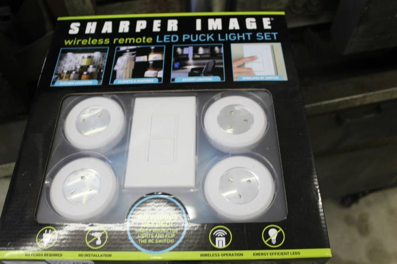 lot 225 image: Sharper Image Wireless Remote LED Puck Light Set
