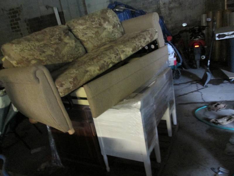 lot 18 image: RV couch with dresser and desk...