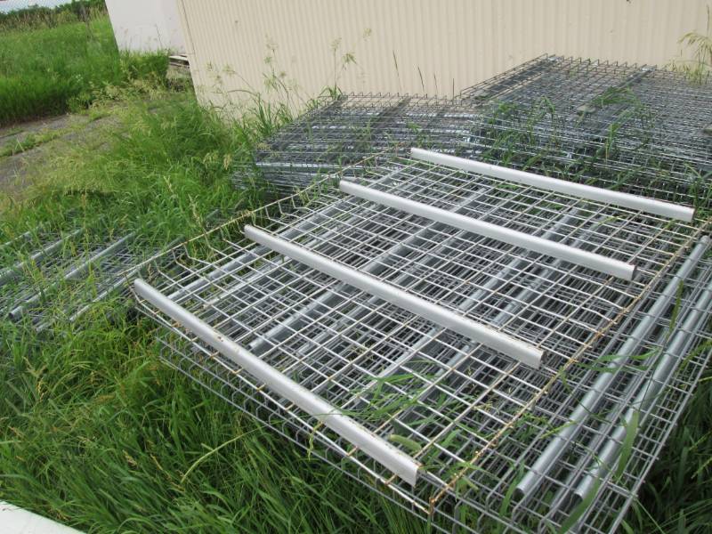 4 piles of pallet rack shelves...