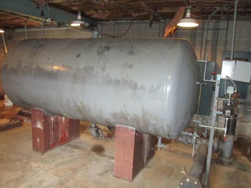 Large metal water tank and pump sys...