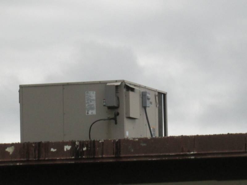 HVAC unit on the roof of the far ea...
