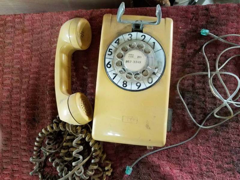 lot 57 image: Vintage wall phones Yellow