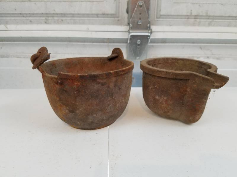 lot 92 image: Two cast iron pots