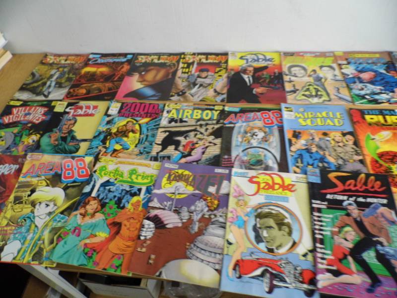 lot 102 image: Lot of Comics