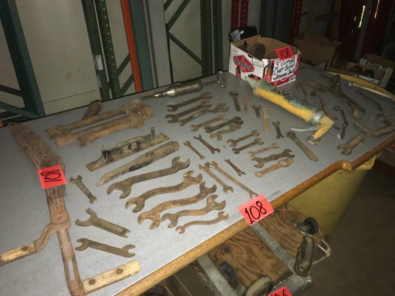 lot 108 image: Large Group Antique Artifacts, Scythe, Wrenches, Grease Gun, Socket, Cast Wheels (over 50 items)