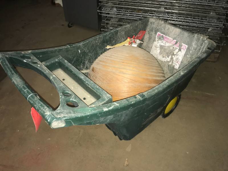 lot 64 image: Plastic Wheel Barrow wceramic mystery globe (tank) to fill balloons