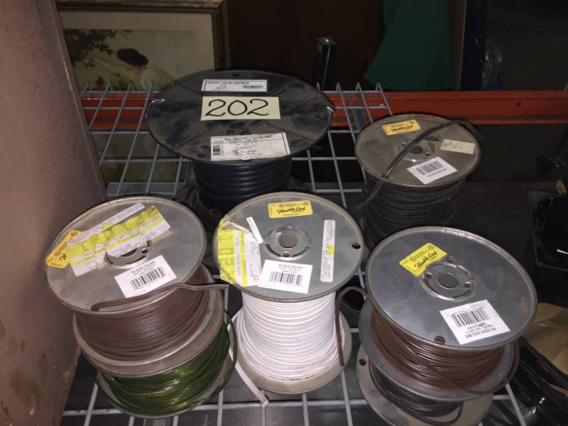 lot 202 image: Spools of lamp cord (5 ct) approx 1000 ft, 1- spool of landscape outdoor wire