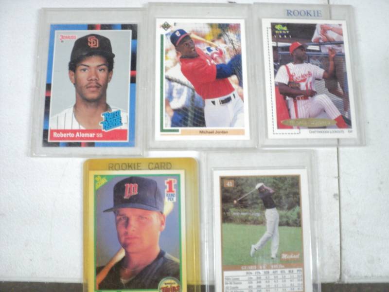 4 Basketball Cards and 1 Golf Card...