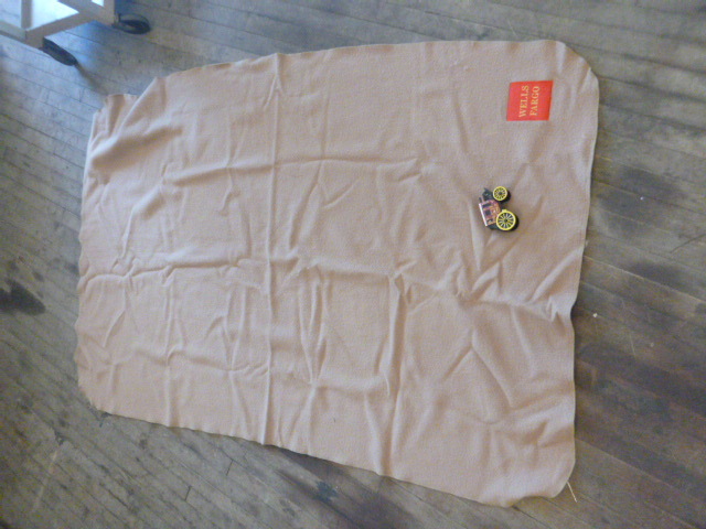 lot 101 image: Wells Fargo Blanket and Piggy Bank