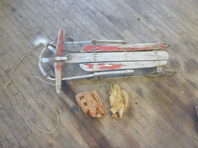 lot 110 image: Vintage Wooden Sled with 2 Baseball Gloves