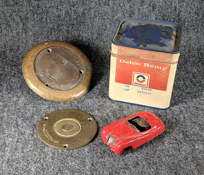 lot 106 image: Miscellaneous Lot 5 - Distributor Cap, Tin Toy, Outlet Covers