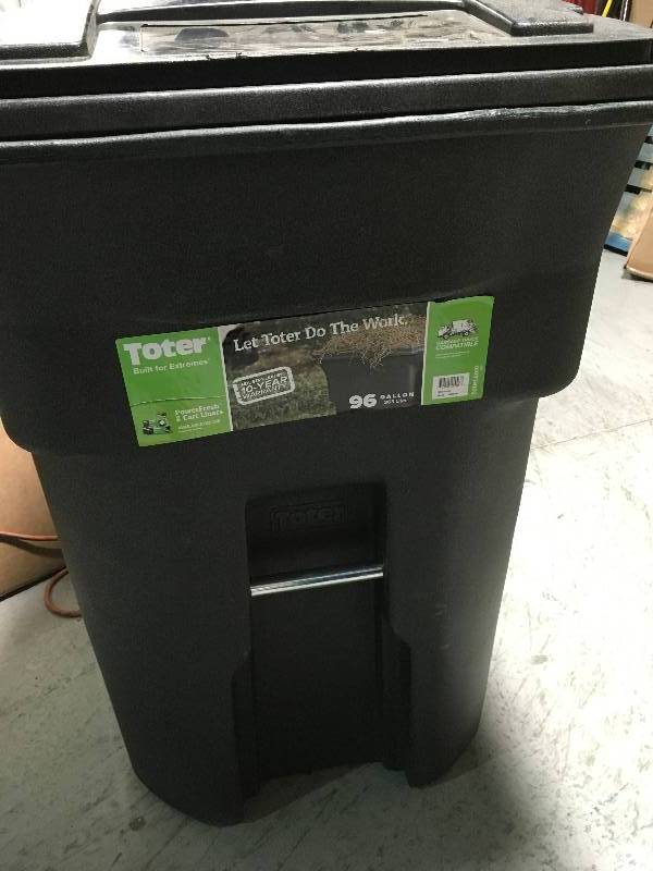 lot 13 image: Toter 48 Gal. Greenstone Trash Can with Wheels and Attached Lid not used