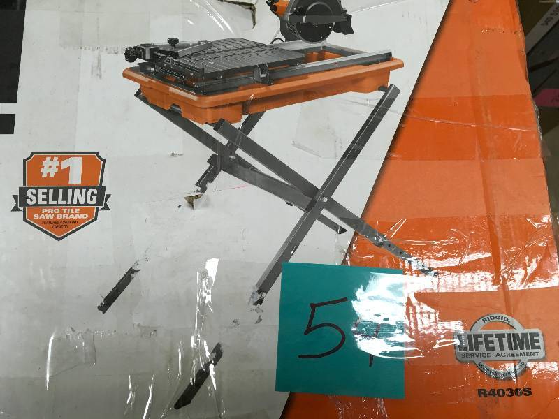 lot 54 image: Ridgid 7 in. Tile Saw with Stand in good condition