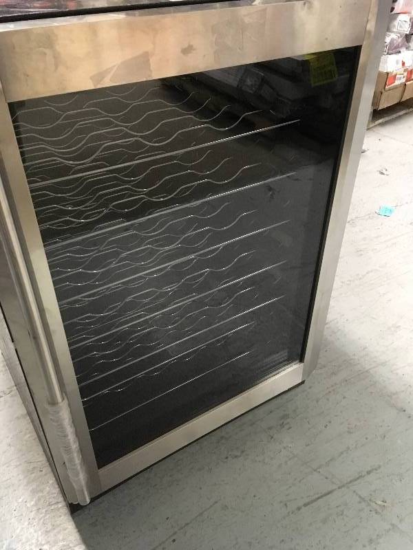 Magic Chef 23.4 in. W 50-Bottle Wine Cooler in Stainless Steel some scratches in good condition
