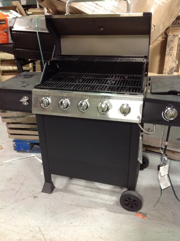 lot 114 image: Dyna Glo 5-Burner Open Cart LP Gas Grill in Stainless Steel and Black with Side Burner whit damage on the sides