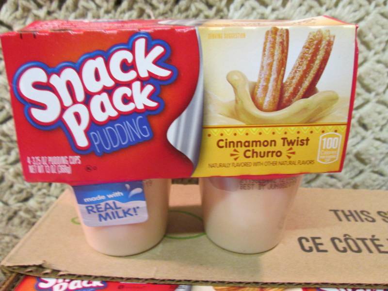 lot 82 image: Case of 12 4-Pack Cups of Cinnamon ...