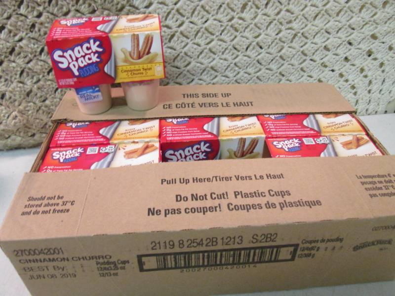 lot 83 image: Case of 12 4-Pack Cups of Cinnamon ...