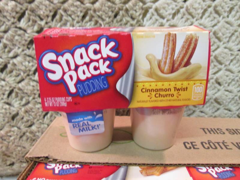lot 84 image: Case of 12 4-Pack Cups of Cinnamon ...