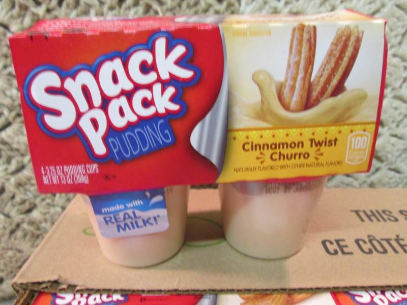 lot 85 image: Case of 12 4-Pack Cups of Cinnamon ...