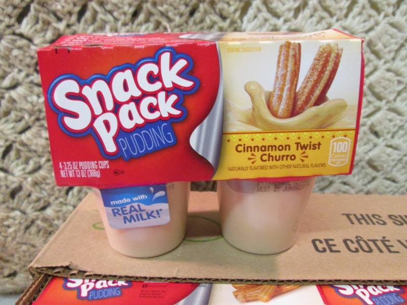 lot 87 image: Case of 12 4-Pack Cups of Cinnamon ...