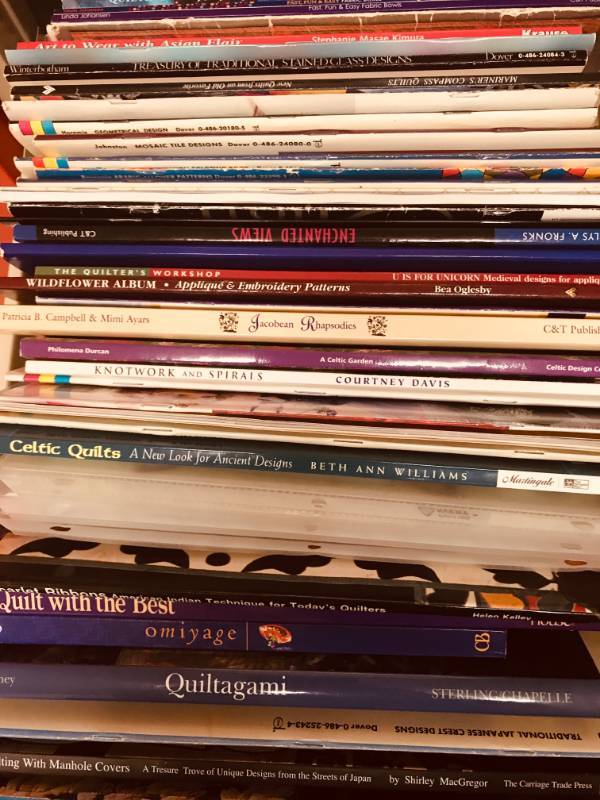 lot 102 image: File Cabinet Drawer Full of Books on Origami, Quilting, Stain Glass, Etc.