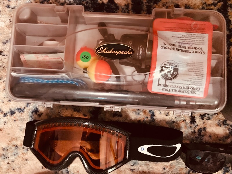 lot 180 image: Oakley  Spyder   Yaktrax, (2) Shakespeare Fishing Kits , Eddie Bauer Lunchbox