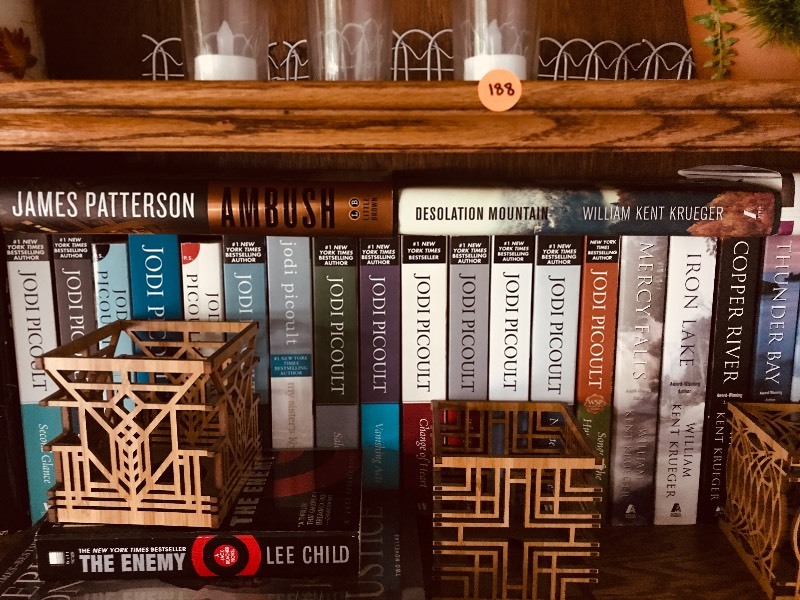 lot 188 image: Book Collection  Jodi Picoult and additional Home Decor Etc.