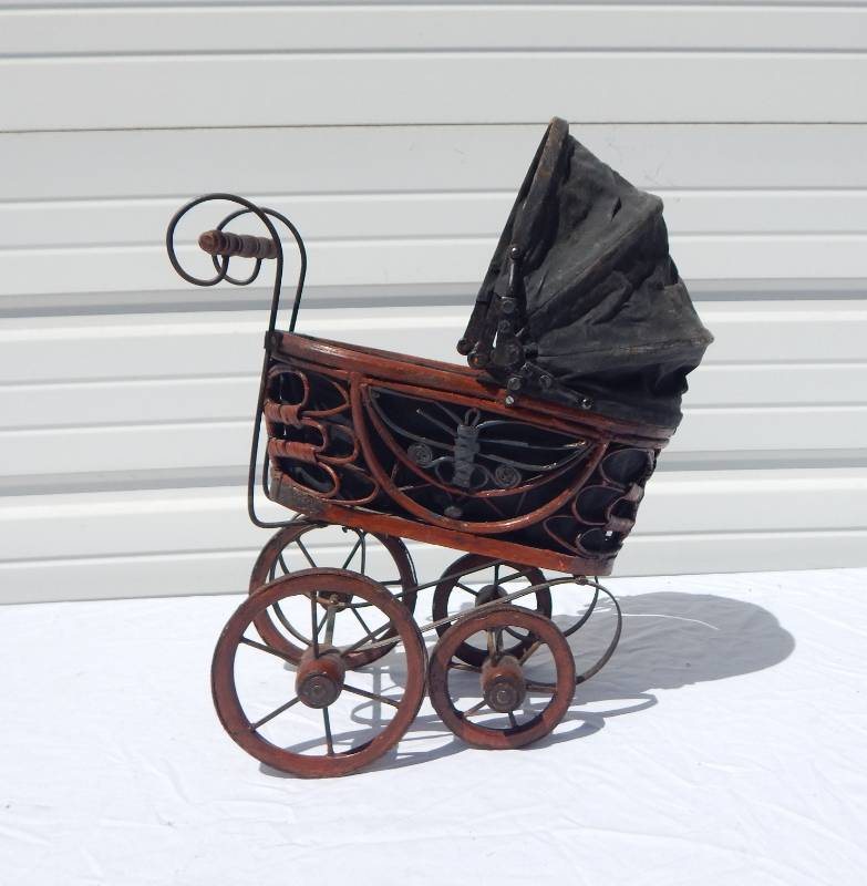 lot 93 image: Decorative Metal and Wood Mini Doll Carriage
