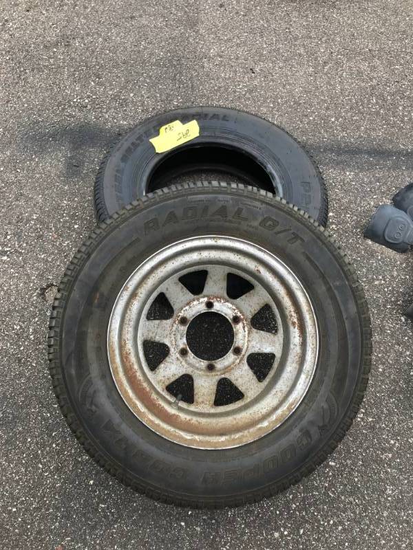 lot 295 image: Cooper Tire Steel Rim - One NEW 215-70-15 Tire - GREAT for a spare