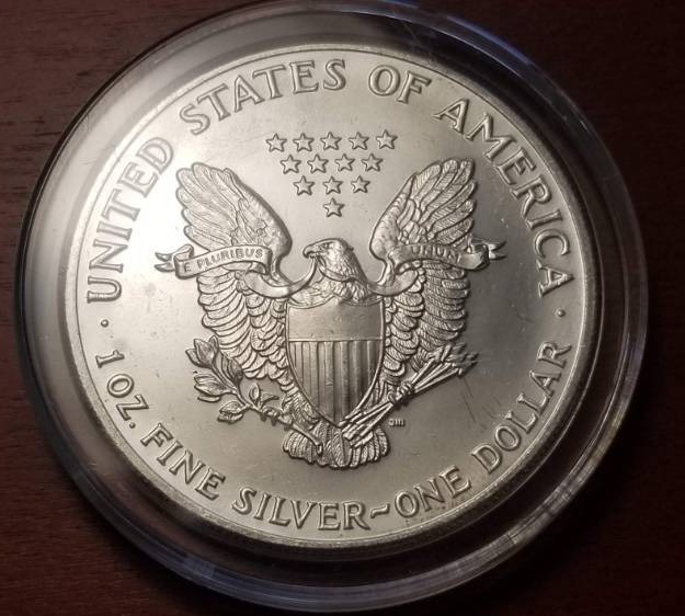 1990 AMERICAN SILVER EAGLE 1 TROY OZ. .999 FINE SILVER IN AIRTITE