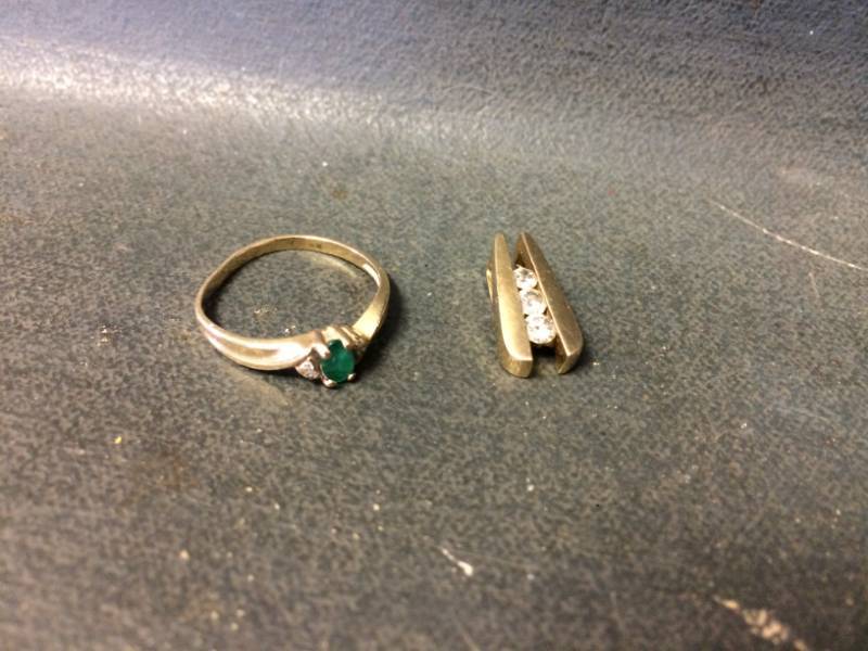 lot 40 image: Gold Ring and Charm