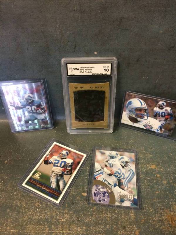 lot 44 image: Barry Sanders Football Cards with GradedSlabbed TV Cel Predictor Card