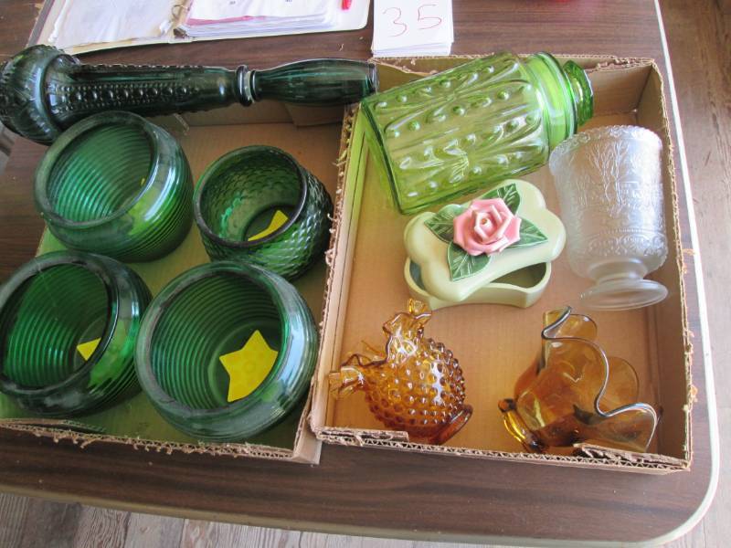 lot 35 image: Dabs genie bottle and a biscuit jar...