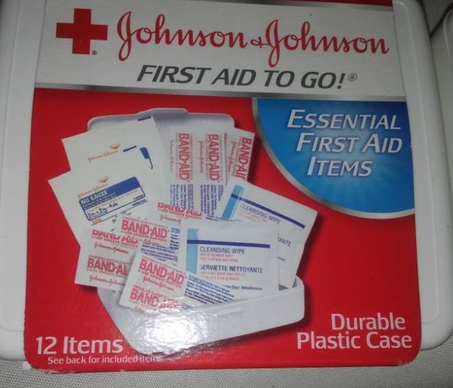 lot 19 image: Johnson & Johnson first aid kits and Band-Aid tape.