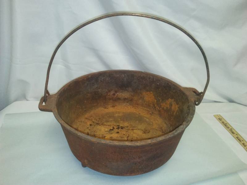 lot 27 image: Cast Dutch oven handle. 12 diameter
