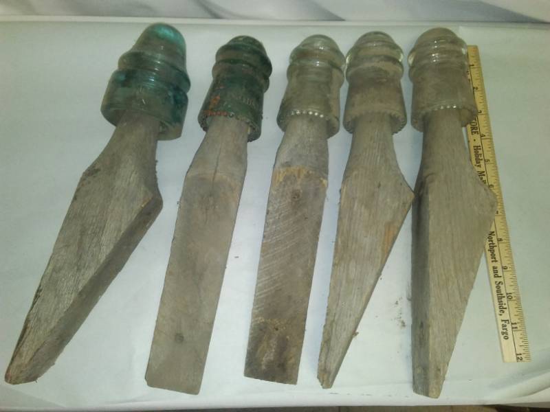 lot 32 image: Five insulators on original wood stands
