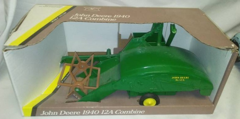 lot 144 image: John Deere model 12a, 1940 combine. Ertl 116 scale in box.