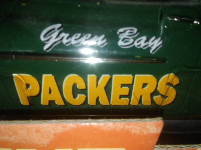 lot 148 image: Green Bay Packers 1950 Oldsmobile Rocket 88 coin Bank