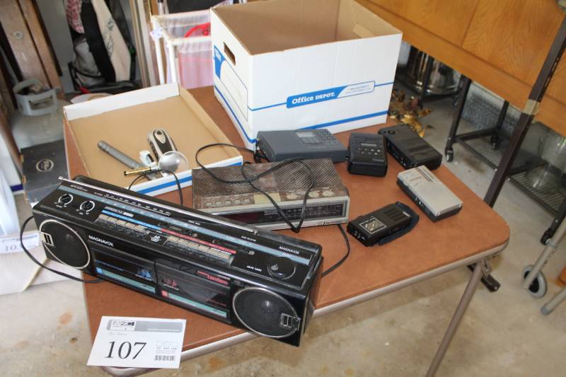 lot 107 image: Magnovox Boom Box, Emerson Alarm Clock Radio, Lanier Cassette Recorder, Magnavox Cassette Recorder, RadioShack Recorder, Walkman AMFM