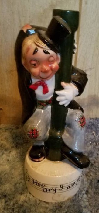 lot 6 image: Plunger - Music box Liquor Decanter