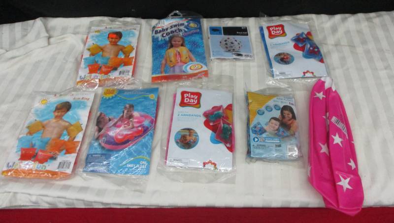 lot 49 image: Beach Toys Ballsm Arm Rings, Tubes balls and more