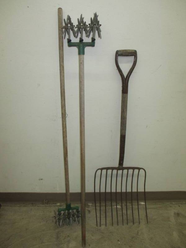 lot 107 image: 2 garden weesils and a silage Fork