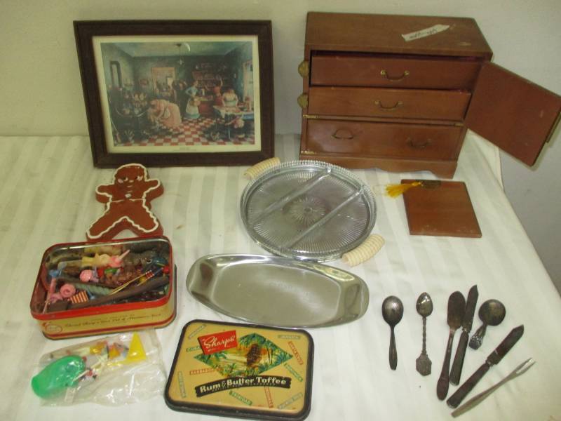 lot 144 image: Gingerbread spoon Rest, Music Box, Picture, Beautiful devided dish very old and tin full of Old Candle Holders, Old utinisils and Candles