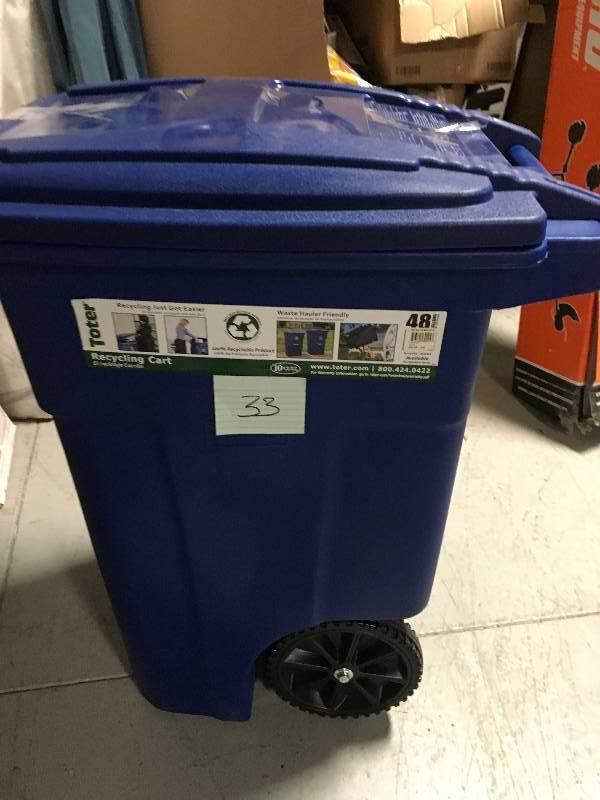 lot 33 image: Toter 48 Gal. Greenstone Trash Can with Wheels and Attached Lid not used