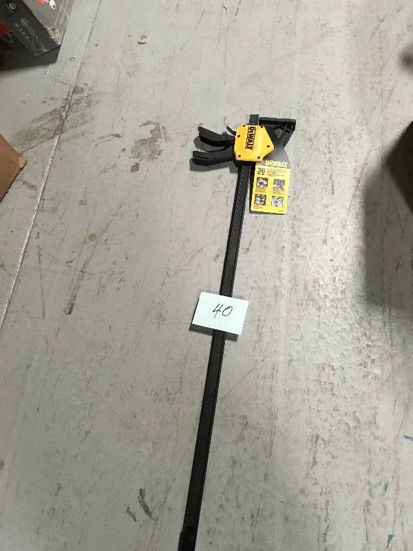 lot 40 image: Dewalt 36 in. 600 lb. Trigger Clamp w3.75 in. Throat Depth not used