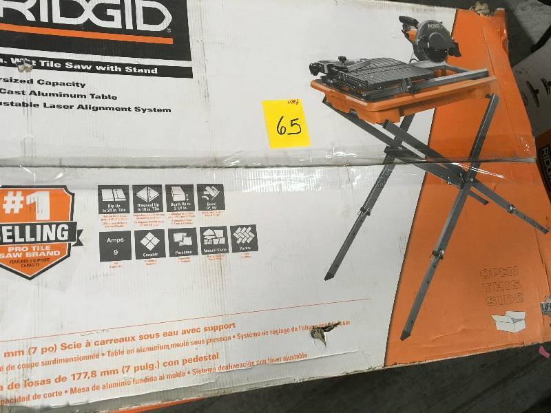 lot 65 image: Ridgid 7 in. Tile Saw with Stand in like new  condition